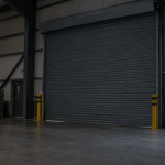 Closed industrial roller shutter at a commercial premises during a power interruption, with the opening kept clear.